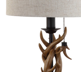 JONATHAN Y desk side table lamp built for versatile placement in rustic spaces.