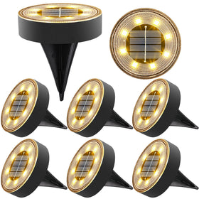 Joomer solar ground light 8-pack illuminating a pathway with warm white glow