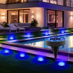 Joomer Solar Ground Light disc blue lights a pathway along a garden border