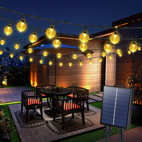 Joomer solar string lights along a garden path for warm ambient lighting