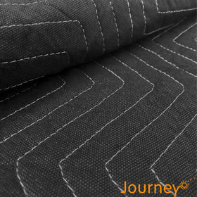 JourneyO heavy-duty moving blanket in black showing rugged weave and dense padding.