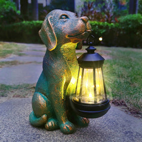 JoyBee dog statue with solar lantern lights the outdoor path gently.