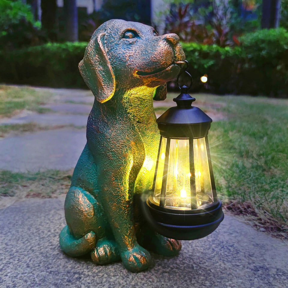 JoyBee dog statue with solar lantern lights the outdoor path gently.