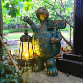 JOYBEE garden turtle figure illuminated by solar lantern for cozy evenings.