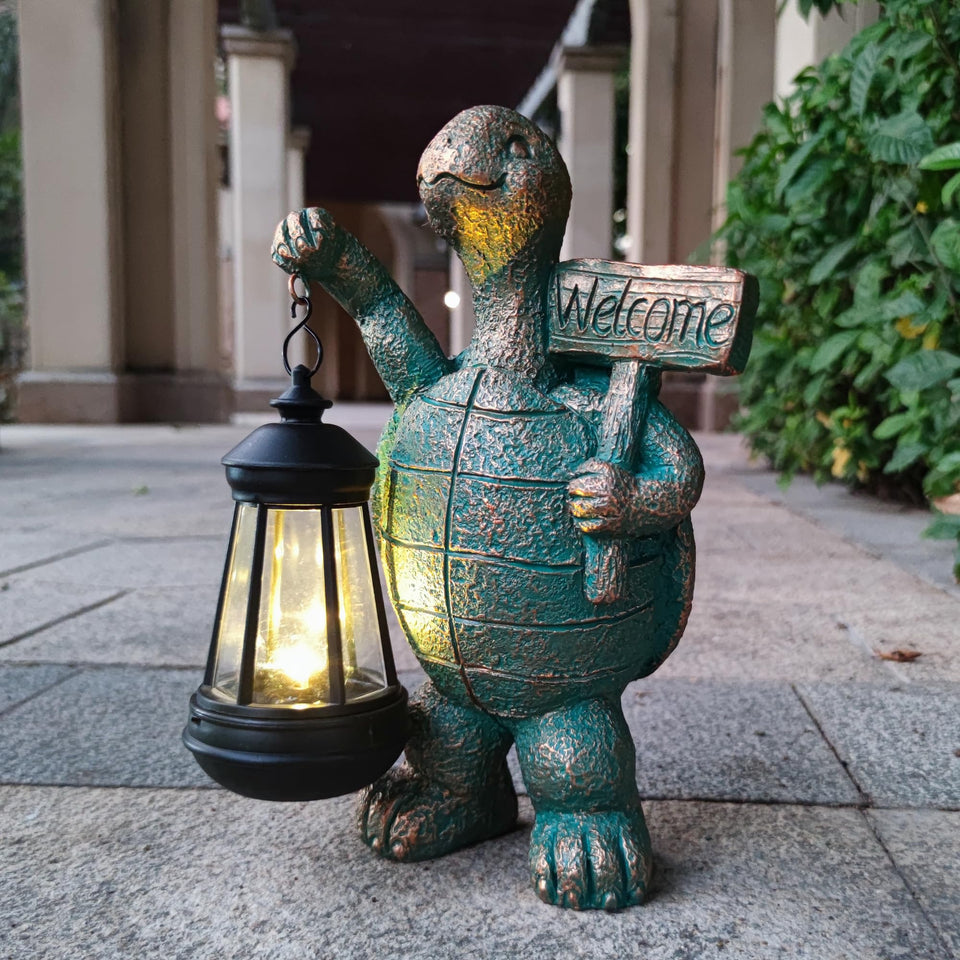 JOYBEE turtle solar lantern statue adds a warm outdoor glow.