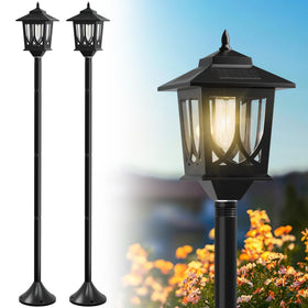 Joyoowild 63-inch solar lamp post lights emit warm white glow for outdoor nights.