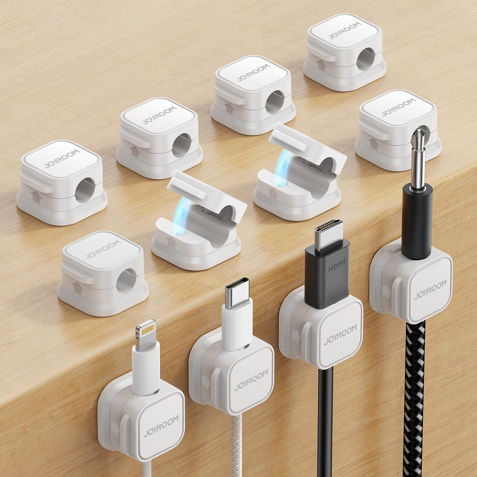 Joyroom magnetic cord holder on a desk keeps cables tidy and organized.