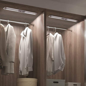 Joyzy 2-pack motion sensor closet light on a shelf for clear visibility.