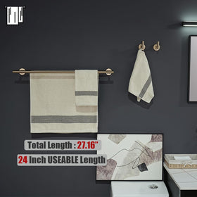 JQK champagne bronze toilet paper holder on clean wall surface