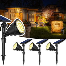 JSOT 600lm solar spotlight illuminating backyard path at night