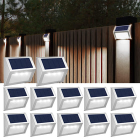 JSOT solar fence lights on fence at dusk, boosting perimeter visibility