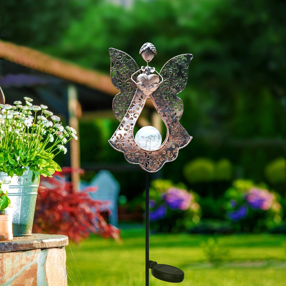 KAIXOXIN LED solar stake lights glow warmly at dusk along a garden path