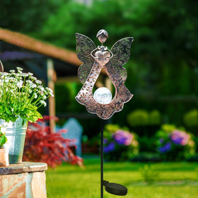 KAIXOXIN LED solar stake lights glow warmly at dusk along a garden path