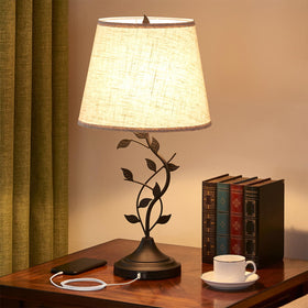 Kakanuo table lamp with tree-branch base for a tasteful bedside glow.
