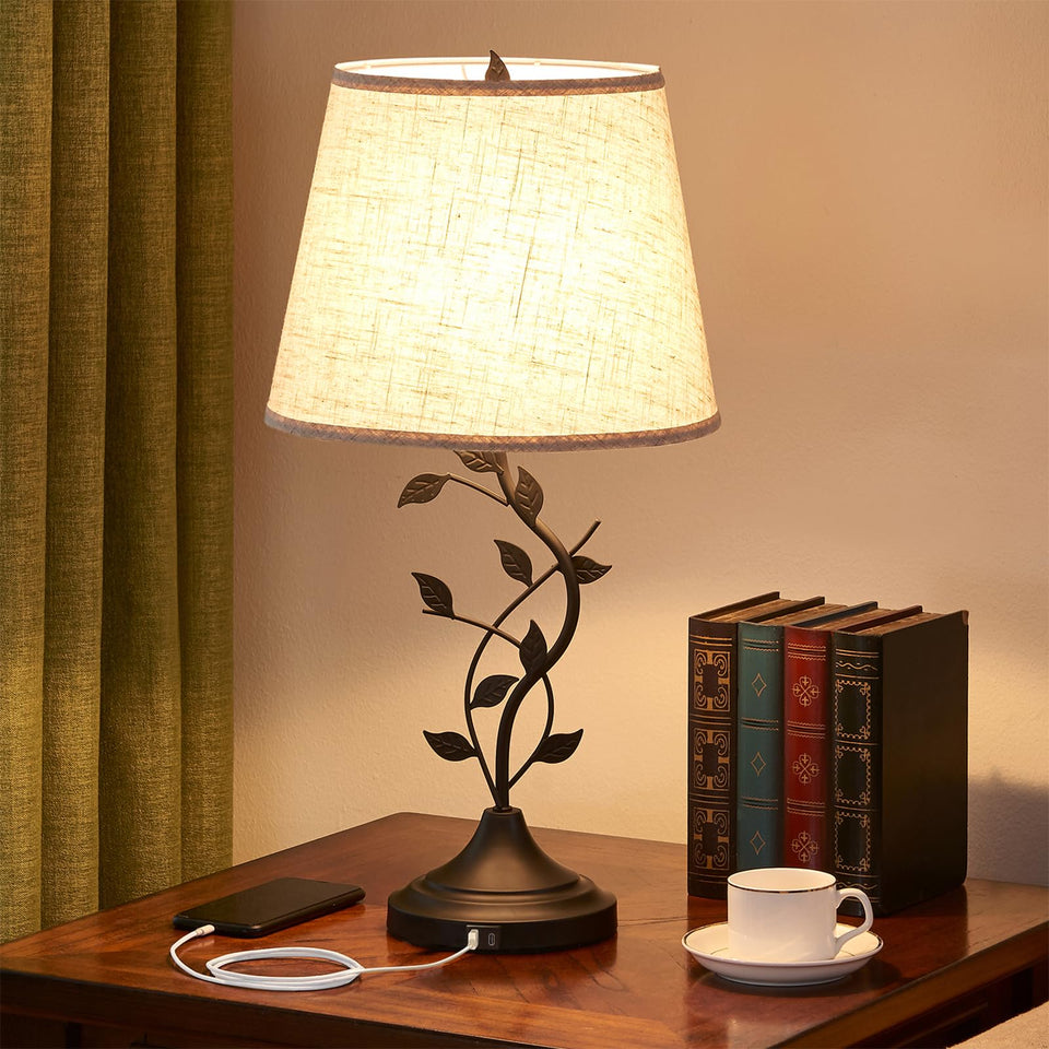 Kakanuo table lamp with tree-branch base for a tasteful bedside glow.
