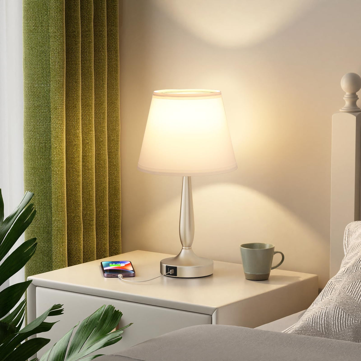 Kakanuo table lamp on bedside table complements nightstand decor.