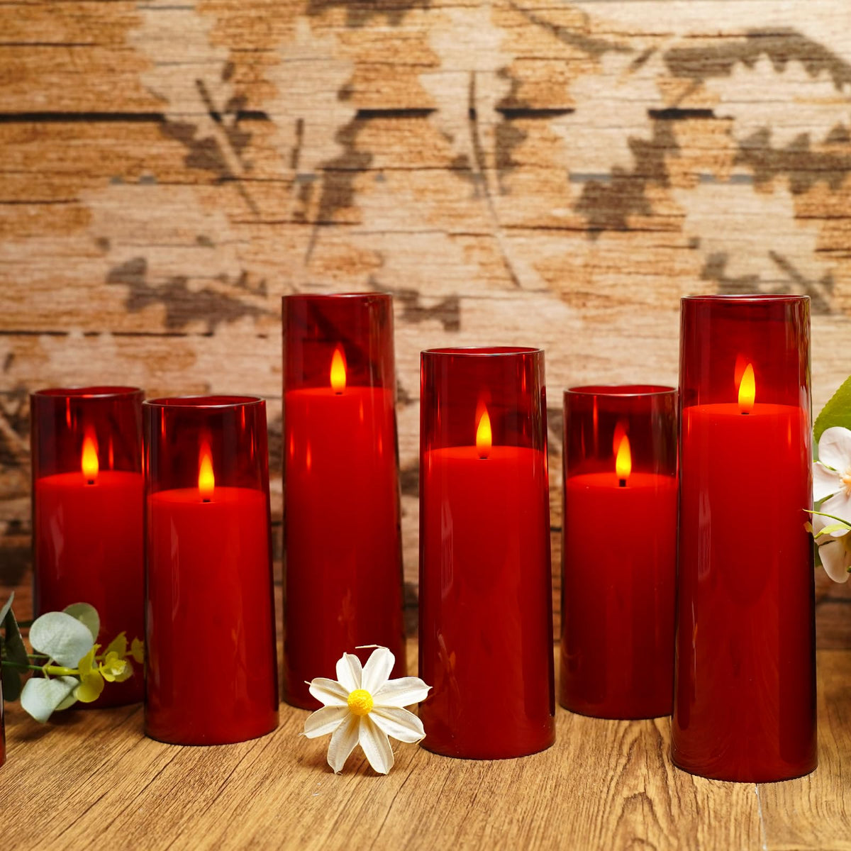 Kakoya pack of nine red LED pillar candles arranged as a table centerpiece.