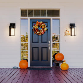 Kalium wall sconce with toughened frame offers durable exterior lighting.