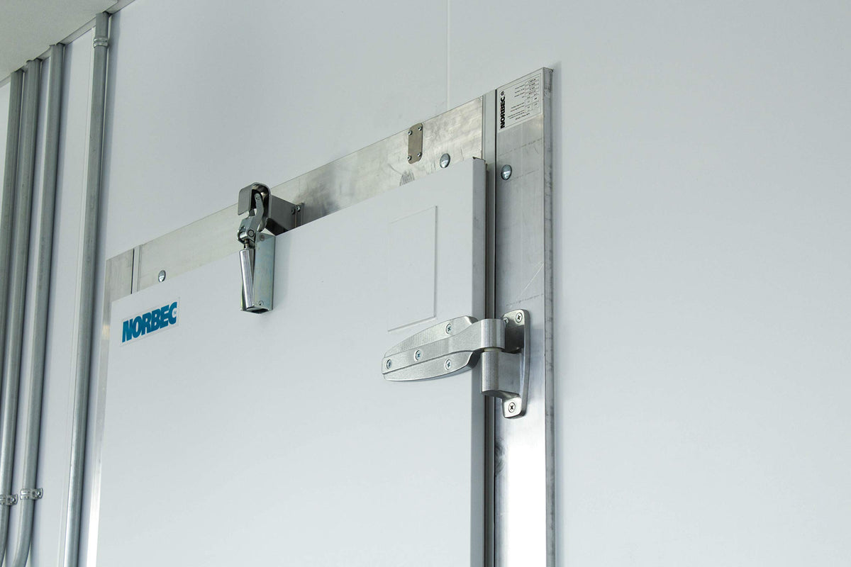Kason 1094 SureClose installed on a door demonstrates concealed mounting aesthetics and reliability.
