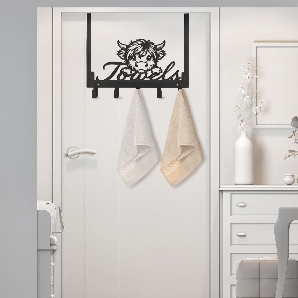 Kathfly Highland Cow hooks in a kitchen setting for towels and utensils.
