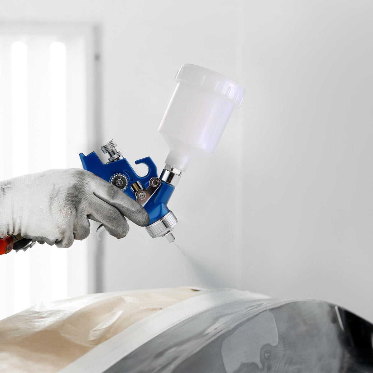 KCNKCN Mini HVLP in automotive touch-up context delivers smooth, controlled finish.