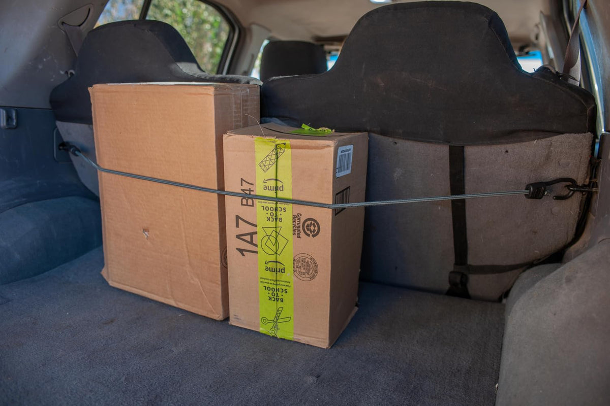 Keeper bungee cord in use for outdoor, travel, and home organization scenarios.