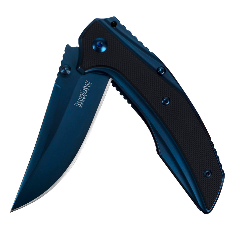 Kershaw Outright blue blade closeup highlighting sharp edge for daily slicing
