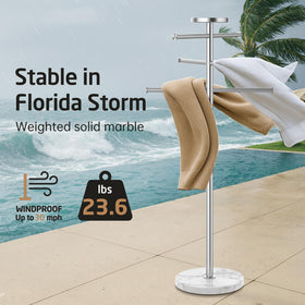 KES three-arm adjustable rack stores towels and swimwear efficiently.