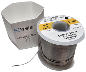 Kester solder on a workbench demonstrates smooth flow for precise electronics assembly.