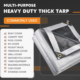 Keten tarp safeguarding lumber and firewood from moisture and spoilage.