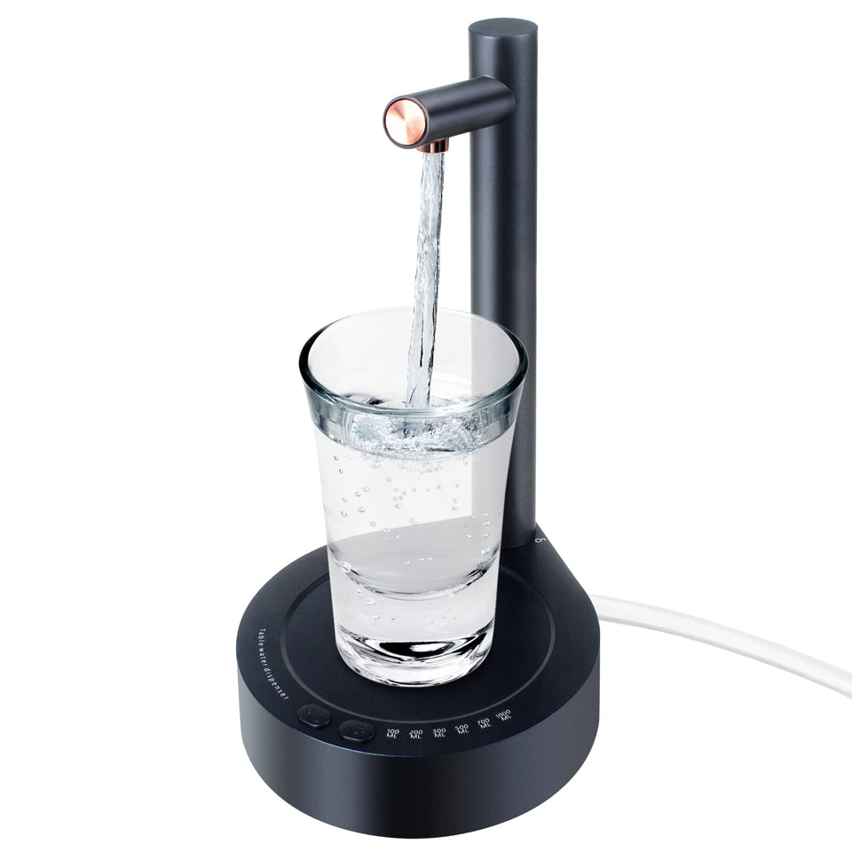 Keweis desktop dispenser on a kitchen counter showing a smooth pour.