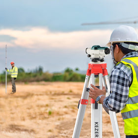 KEZERS aluminum survey tripod providing stable measurements on uneven ground