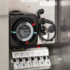 Kichler 15557BK timer housing in black plastic and aluminum for durability.