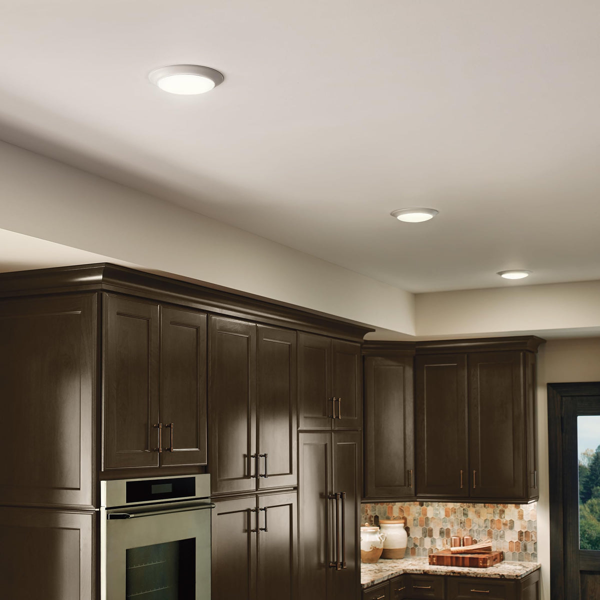 Kichler Gen I LED downlight retrofit-kit over housing illustrates renovation-friendly upgrade.