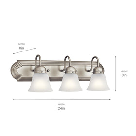 Kichler vanity light over a mirror enhances task lighting.