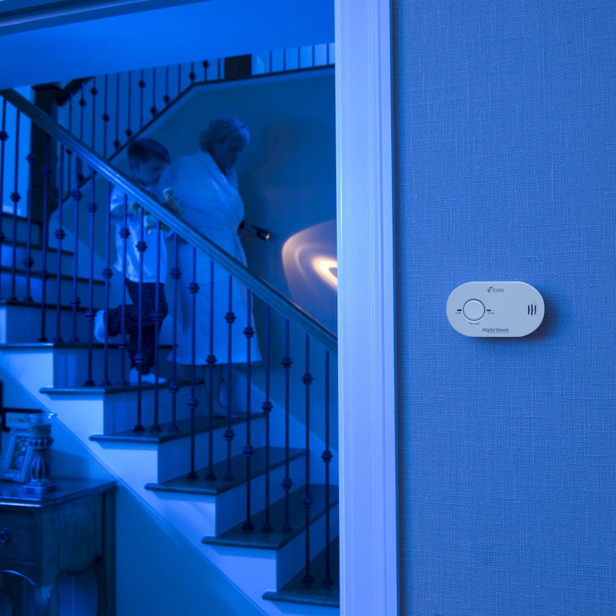 Kidde Nighthawk CO alarm wall mount in a living room for steady monitoring
