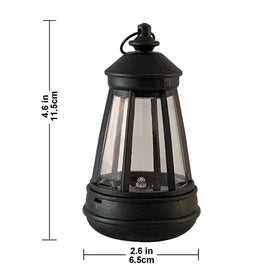 Killoywin mini solar lantern on a patio for warm evening illumination.
