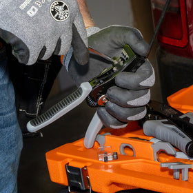 Close-up of precision stripping holes on Klein 11069S enabling clean insulation removal