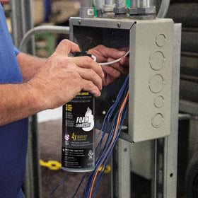 Klein Tools 51100 foam lubricant demonstrates mess-free application on vertical conduit