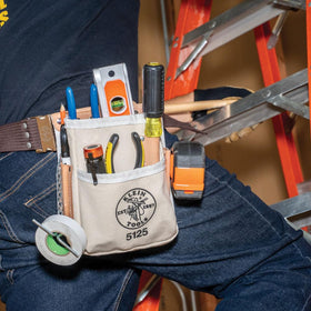 Klein Tools 5125 chain tape thong secures tape when moving between tasks.