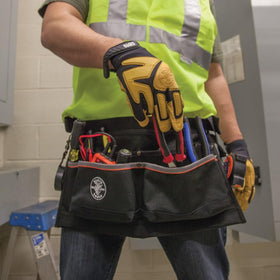 Klein Tools 5244 apron in use shows secure, all-day comfortable wear.