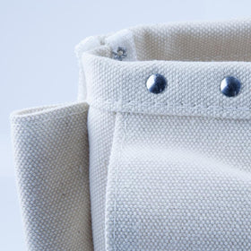 Durable stitching and rivets help the bag endure daily use.