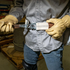 Klein Tools 5425M worn over harness and clothing with drop-free release.