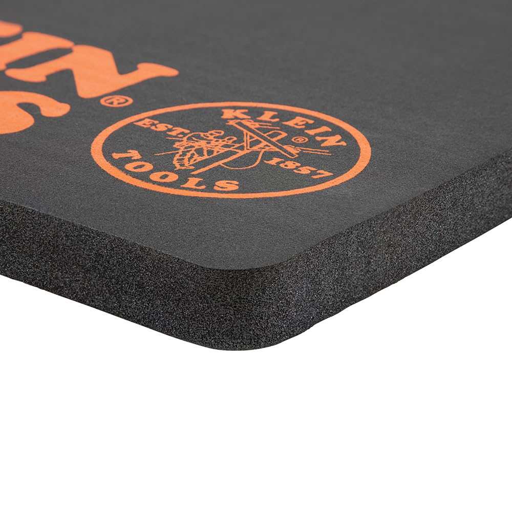 Klein Tools 60135 kneeling pad in use on a busy jobsite.