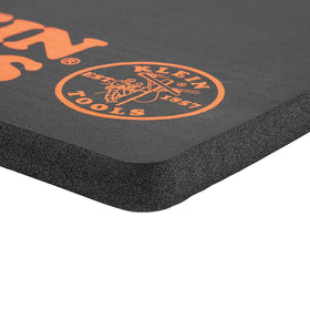 Klein Tools 60135 kneeling pad in use on a busy jobsite.