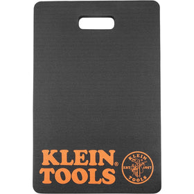 Klein Tools 60135 kneeling pad stored with handle for portable storage.
