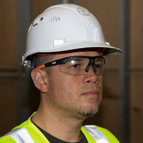 Klein Tools safety glasses with rubber nose piece improve grip during long shifts.