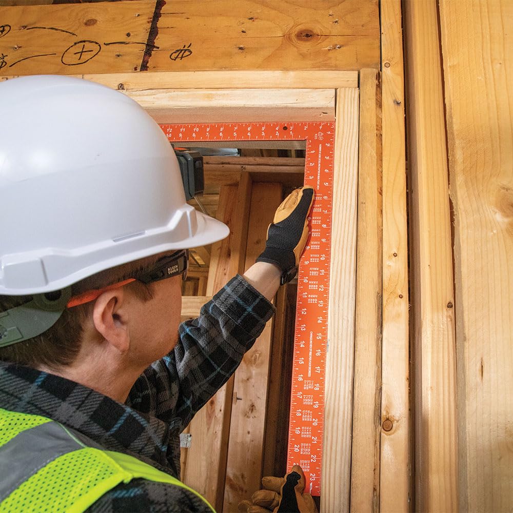 Klein Tools 935FSQ framing square shows built in rafter tables for carpentry calculations.