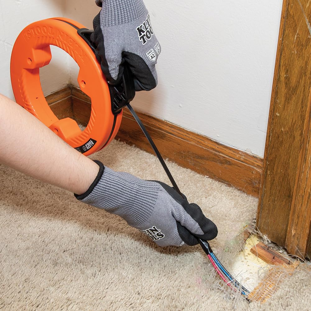 Compact housing design reduces payout effort on Klein Tools tape.