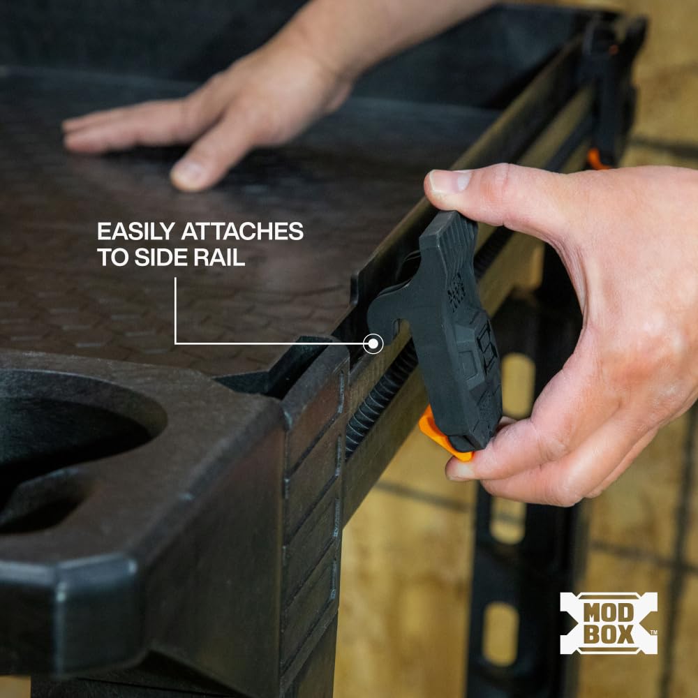 Klein Tools MODBox clip-on ladder holder enables quick, one-handed setup.